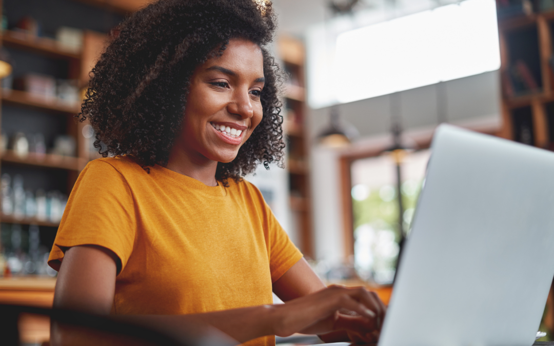 Woman using a laptop for work for an article about getting the most from Microsoft's new partner program